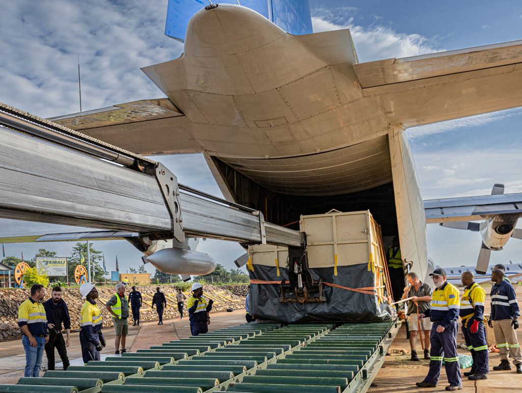 Rhinos being removed from the cargo plane for relocation